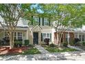 Inviting townhome featuring tidy landscaping, green shutters, sidewalk, and visible house numbers at 224 Jackson St, Goose Creek, SC 29445