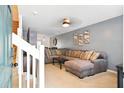 Cozy living room with a sectional sofa, neutral walls, carpet, and ceiling fan with lighting at 224 Jackson St, Goose Creek, SC 29445