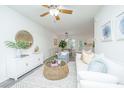 Inviting living room featuring neutral tones, stylish furniture, decorative mirror, and hardwood floors at 2954 Woodland Park Dr, Mount Pleasant, SC 29466