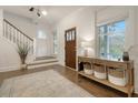 Bright foyer featuring hardwood floors, a wooden door, natural light and modern décor at 303 S Ladd Ct, Charleston, SC 29492