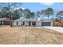 Charming home with a gray front door, inviting porch, and a well-maintained lawn at 402 Woodward Blvd, Summerville, SC 29483