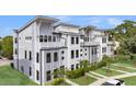 Desirable townhome showcases modern architecture, private balconies, and lush landscaping at 4414 Avery Ave, North Charleston, SC 29405