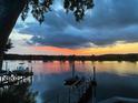 Picturesque sunset view overlooking the tranquil river and private dock at 4940 Lambs Road Rd, North Charleston, SC 29418