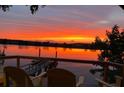 Breathtaking water view featuring a vibrant orange sunset over the river from the outdoor seating area at 4940 Lambs Road Rd, North Charleston, SC 29418