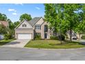Lovely brick home on a corner lot with well-maintained landscaping and a two-car garage at 5413 Barnsley Dr, North Charleston, SC 29420