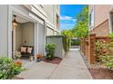 Charming walkway with a bench, lush greenery, and a view of the adjacent brick and siding building at 656 Coleman Blvd # 405, Mount Pleasant, SC 29464