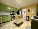 Bright kitchen with stainless steel appliances and ample cabinet space at 922 Dill Ave, Charleston, SC 29412
