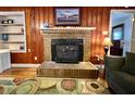 Living room with a brick fireplace and built in shelves at 922 Dill Ave, Charleston, SC 29412