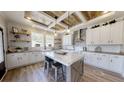 Beautiful open kitchen with modern island, stylish lighting, and white cabinets at 966 Tiger Loop, Saint Stephen, SC 29479