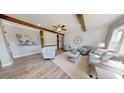 Cozy living room with wood beams, plank wall, and neutral-toned furniture at 966 Tiger Loop, Saint Stephen, SC 29479