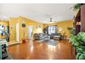 Spacious living room featuring hardwood floors, neutral colors and large windows at 9759 Seed St, Ladson, SC 29456