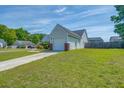 Shows the home's side yard, driveway, and a one car attached garage at 101 Old Tree Rd, Goose Creek, SC 29445