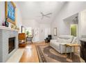 Comfortable living room with vaulted ceilings, a fireplace, and hardwood floors at 1116 Daffodil Ln, Mount Pleasant, SC 29464