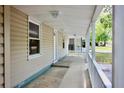 Spacious covered porch featuring classic railing offering space for relaxing outdoors at 1232 Hawthorne Cir, Hanahan, SC 29410