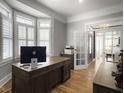 Home office with hardwood floors, a large desk, and plenty of natural light at 127 Beresford Creek St, Daniel Island, SC 29492