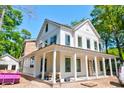 New two-story home featuring a covered wraparound porch with white pillars at 1430 Hindman Ave, Mount Pleasant, SC 29464