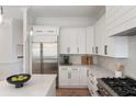 Modern kitchen featuring white cabinets, stainless steel appliances, and sleek countertops at 1505 Rivertowne Country Club Dr, Mount Pleasant, SC 29466
