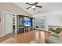 Bright living room with hardwood floors and access to outdoor patio through French doors at 157 Townsend Way, Summerville, SC 29483