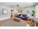 Bright living room featuring hardwood floors, a ceiling fan, and a cozy seating area at 1821 Wasp St, North Charleston, SC 29405