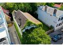 An aerial view showcases an old house covered in vines, nestled among other properties at 20 Felix St, Charleston, SC 29403