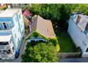 An aerial view shows the dilapidated house surrounded by colorful neighboring properties at 20 Felix St, Charleston, SC 29403