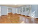 Bright living room with hardwood floors, offering seamless flow into adjacent rooms at 210 Padgett Loop, Walterboro, SC 29488