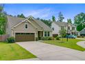 Beautiful single-story house with lush green lawn and driveway at 219 Whirlaway Dr, Moncks Corner, SC 29461