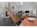 Open-concept space with vaulted ceiling, staircase, sleek kitchen, and modern decor at 221 Ashley Ave # Abc, Charleston, SC 29403