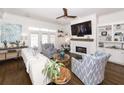 Bright living room with stylish decor, fireplace, and hardwood floors for comfortable living at 3013 Middle St, Sullivans Island, SC 29482