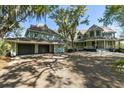 Lovely traditional style home with a large driveway and a detached three-car garage at 3104 Upda Creek, Seabrook Island, SC 29455