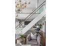 Bright open space with hardwood floors, glass railing and plenty of natural light at 330 Concord St # 18F, Charleston, SC 29401