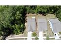 Aerial view of houses with trees and a road at 3997 Aspera Dr, Summerville, SC 29483