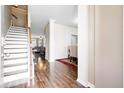 Inviting entryway featuring wood floors, staircase, and an open view of the dining and living areas at 413 Ribiero Dr, Summerville, SC 29486