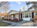 Beautiful brick home with a cozy porch and manicured landscaping at 4437 Garwood Dr, Ladson, SC 29456