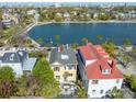 Stunning aerial view of the home with a waterfront view and city skyline in the background at 49 Ashley Ave, Charleston, SC 29401