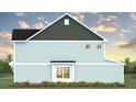 Side view of home with blue siding, dark gray trim, and blooming flowers at 561 Gahagan Rd, Summerville, SC 29486