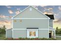 Side view of home with light gray siding, white trim, and flower beds at 561 Gahagan Rd, Summerville, SC 29486