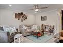 Comfortable living room featuring a plush sofa, stylish decor, and ample natural light at 6279 Lucille Dr # B, North Charleston, SC 29406