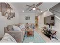 Spacious living room with a large TV, hardwood floors, and comfortable seating at 6279 Lucille Dr # B, North Charleston, SC 29406