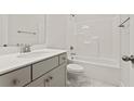 Clean bathroom with a shower/tub combo, white cabinets, a granite countertop, and new fixtures at 753 Maynard Ln, Summerville, SC 29486