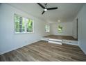Inviting living room with natural light, wood floors, and elevated platform at 100 Colonial Dr, Goose Creek, SC 29445