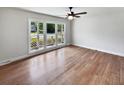 Bright, airy room with hardwood floors and large windows, offering a versatile space for any homeowner's needs at 102 Rebellion Rd, Summerville, SC 29483