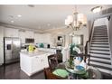 Modern kitchen featuring white cabinets, stainless steel appliances, and a center island with seating at 113 Crosscut Ln, Summerville, SC 29486