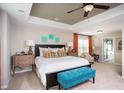 Spacious main bedroom with a tray ceiling, a king-sized bed, and an en-suite bathroom at 113 Crosscut Ln, Summerville, SC 29486