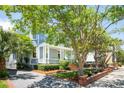 Charming two-story home with a covered porch, mature landscaping, and lovely trees at 15 Rutledge Ave, Charleston, SC 29401