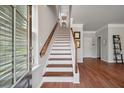 Bright entryway with hardwood floors and stairs leading to the upper level at 1589 Bluewater Way, Charleston, SC 29414