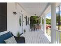 Inviting front porch with white columns, seating, and a cozy ambiance at 1920 Iris St, North Charleston, SC 29405