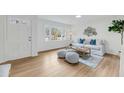 Bright living room with hardwood floors, white walls, and lots of natural light at 2462 Swallow Dr, Charleston, SC 29414