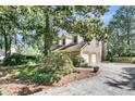 Exterior view of home with a two car garage and mature trees at 3 Birmingham Ct, Charleston, SC 29407