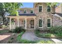 Charming brick home with a landscaped front yard, a covered porch, and curb appeal at 3 Birmingham Ct, Charleston, SC 29407